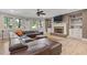 Finished basement with a large leather couch and brick fireplace at 2814 Adams Oaks Ln, Marietta, GA 30062
