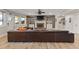 Finished basement with a large leather couch and brick fireplace at 2814 Adams Oaks Ln, Marietta, GA 30062