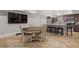 Open basement kitchen and dining area features stainless appliances and light wood-look floors at 2814 Adams Oaks Ln, Marietta, GA 30062