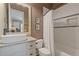 Bright bathroom boasts a stylish vanity, decorative tiles, and a shower-tub combination at 2814 Adams Oaks Ln, Marietta, GA 30062