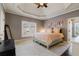 Bedroom with a trey ceiling, carpet, and view of the exterior at 2814 Adams Oaks Ln, Marietta, GA 30062