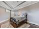 Cozy bedroom with hardwood floors, tray ceiling and a comfortable queen-sized bed at 2814 Adams Oaks Ln, Marietta, GA 30062