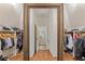Walk-in closet with custom organizers and an antique gold framed mirror at 2814 Adams Oaks Ln, Marietta, GA 30062