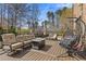 Inviting outdoor deck space with comfortable seating, a fire pit, and a unique hanging chair at 2814 Adams Oaks Ln, Marietta, GA 30062