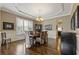 Traditional dining room featuring a coffered ceiling, hardwood floors, and large windows with shutters at 2814 Adams Oaks Ln, Marietta, GA 30062