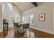 Dining area with vaulted ceilings, large windows with plantation shutters, and hardwood floors at 2814 Adams Oaks Ln, Marietta, GA 30062