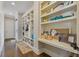 Hallway featuring custom built-ins, shelving, storage spaces and hardwood floors at 2814 Adams Oaks Ln, Marietta, GA 30062