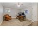 Home office with natural light, wood floors and a decorative chair at 2814 Adams Oaks Ln, Marietta, GA 30062