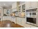 Elegant kitchen with white cabinetry, granite countertops, and stainless steel appliances at 2814 Adams Oaks Ln, Marietta, GA 30062