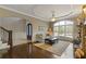 Bright and airy living room with a stone fireplace and view of the outdoors at 2814 Adams Oaks Ln, Marietta, GA 30062