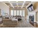 Spacious living room has a large sectional couch, elegant fireplace and expansive windows at 2814 Adams Oaks Ln, Marietta, GA 30062