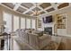 Inviting living room features a coffered ceiling, built-in shelves, fireplace, and large windows at 2814 Adams Oaks Ln, Marietta, GA 30062