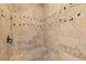 Shower featuring travertine stone and decorative tile accents at 2814 Adams Oaks Ln, Marietta, GA 30062