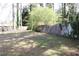 Backyard view showcasing trees and wooden fence that defines the property line at 3274 Jodeco Pl, Jonesboro, GA 30236