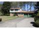 Charming brick home with a two-car garage and a long driveway at 3274 Jodeco Pl, Jonesboro, GA 30236