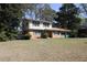 Charming brick home with a two-car garage and a well-maintained front yard at 3274 Jodeco Pl, Jonesboro, GA 30236