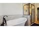 Spa-like bathroom with a freestanding tub and a glass-enclosed shower at 1503 Westwood Sw Ave, Atlanta, GA 30310