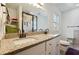 Bathroom featuring double sinks with granite countertops and modern fixtures at 1503 Westwood Sw Ave, Atlanta, GA 30310