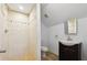 Cozy bathroom with neutral tiling, single vanity, and an enclosed shower at 1503 Westwood Sw Ave, Atlanta, GA 30310