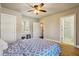 Comfortable bedroom with wood floors and ensuite bathroom at 1503 Westwood Sw Ave, Atlanta, GA 30310