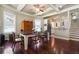 Elegant dining room with hardwood floors and coffered ceilings leading into the kitchen at 1503 Westwood Sw Ave, Atlanta, GA 30310