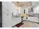 Modern kitchen with white cabinets, stainless steel appliances, and granite countertops at 1503 Westwood Sw Ave, Atlanta, GA 30310
