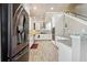 Modern kitchen with stainless steel appliances, white cabinetry, and granite countertops at 1503 Westwood Sw Ave, Atlanta, GA 30310
