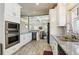 Well-equipped kitchen featuring stainless appliances, a wine cooler and granite countertops at 1503 Westwood Sw Ave, Atlanta, GA 30310