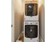 Efficient laundry area with a stacked washer and dryer at 1503 Westwood Sw Ave, Atlanta, GA 30310