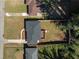 An aerial view of a fenced property with a well-maintained lawn and gray roof at 1882 Rosewood Rd, Decatur, GA 30032