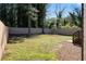 Expansive fenced backyard features a lush lawn and ample space for outdoor activities and entertainment at 1882 Rosewood Rd, Decatur, GA 30032