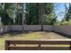 A spacious fenced backyard with trees and lush grass, creating a peaceful outdoor space at 1882 Rosewood Rd, Decatur, GA 30032