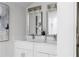 Stylish bathroom featuring a double sink vanity, modern lighting, and elegant countertops at 1882 Rosewood Rd, Decatur, GA 30032
