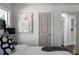 This bedroom features a stylish art piece, soft lighting, and comfortable bed at 1882 Rosewood Rd, Decatur, GA 30032