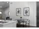 Bright dining area showcases a stylish table set with modern art and is adjacent to the kitchen at 1882 Rosewood Rd, Decatur, GA 30032