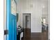 Inviting home entrance featuring a bright blue front door and an open view of the dining room at 1882 Rosewood Rd, Decatur, GA 30032