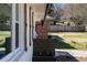 A charming home's exterior is enhanced by decorative shutters and a lovely potted flower arrangement at 1882 Rosewood Rd, Decatur, GA 30032
