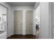 Bright hallway leading to a bathroom and living area, showcasing the open floor plan at 1882 Rosewood Rd, Decatur, GA 30032