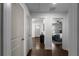 A hallway with hardwood floors leads to the front door and Primary bedroom at 1882 Rosewood Rd, Decatur, GA 30032