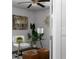 A bright home office features a glass desk, unique decor, and lots of light at 1882 Rosewood Rd, Decatur, GA 30032