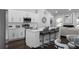 Bright, eat-in kitchen featuring stainless steel appliances, a large island with seating, and modern white cabinetry at 1882 Rosewood Rd, Decatur, GA 30032