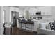 Modern eat-in kitchen with stainless steel appliances, a large island with seating, and white cabinets at 1882 Rosewood Rd, Decatur, GA 30032
