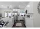 Bright kitchen with stainless appliances, white cabinets, and an open layout with a view to the backyard at 1882 Rosewood Rd, Decatur, GA 30032