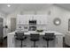 Bright modern kitchen with a large island, stainless steel appliances, and elegant pendant lighting at 1882 Rosewood Rd, Decatur, GA 30032