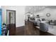 Open-concept living space with hardwood floors, modern furnishings, and a bright kitchen at 1882 Rosewood Rd, Decatur, GA 30032