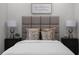 Elegantly designed bedroom boasts two stylish nightstands, plush pillows, and comfortable bedding at 1882 Rosewood Rd, Decatur, GA 30032