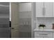 Walk-in pantry features wire shelving and complements the kitchen's design with white cabinets and light countertops at 1882 Rosewood Rd, Decatur, GA 30032