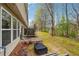 Spacious backyard with a patio area and serene views of the nearby woods and landscape at 2026 Ellison Nw Way # 13, Kennesaw, GA 30152