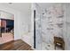 Beautiful bathroom featuring a stylish marble shower with a built-in bench and sleek glass door, alongside a modern soaking tub at 2026 Ellison Nw Way # 13, Kennesaw, GA 30152
