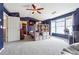 Stylish bedroom with dark blue accent wall, tv, and neutral carpet at 2026 Ellison Nw Way # 13, Kennesaw, GA 30152